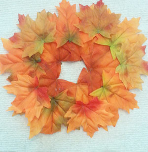Fall leaves glued together to form a wreath