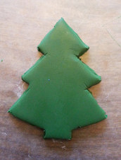 cut a Christmas tree shape out of green sculpey clay