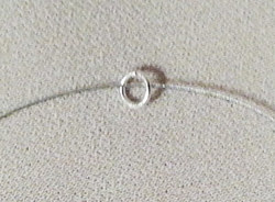 Adding a jump ring to jewelry wire for rhinestone bracelet