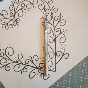 Using a template to paint on a ceramic tile