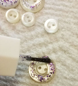 Painting a button with glitter nail polish