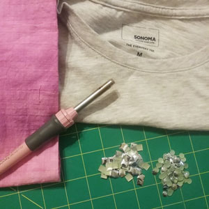 Supplies needed to embellish a tee shirt with metal studs