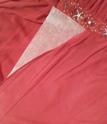 Wax paper between layers of dress to prevent glue from seeping through