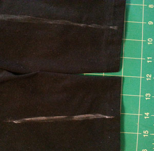 Chalk guidelines to adding design to black leggings