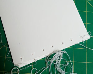 Binding the book with embroidery thread