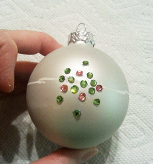 Gluing rhinestones to a Christmas tree ornament