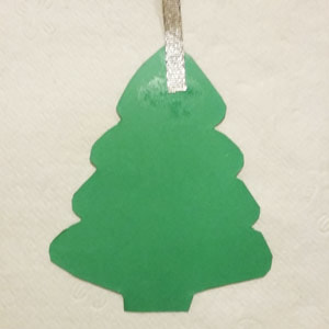 Gluing ribbon to DIY Christmas tags