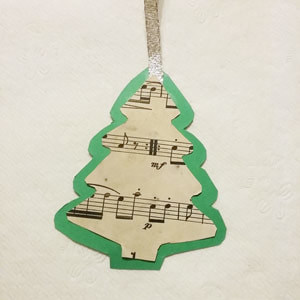 Glue sheet music to card stock for DIY Christmas tags