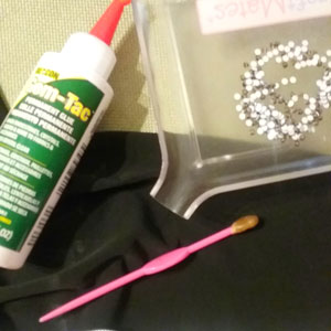 Supplies needed to glue rhinestones to a dress