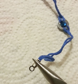 Using fold over crimp ends to finish ends of rhinestone washer bracelet