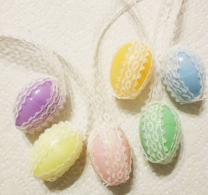 Plastic eggs with lace glued on 4 sides