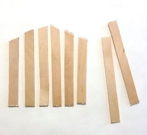 Wooden craft sticks cut in ascending slats