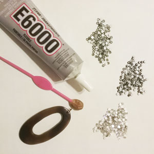 Supplies needed to make a blinged out rhinestone pendant