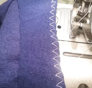 Sewing facing to edges to tighten of altered t shirt to tighten openings