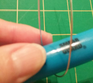 wrapping wire around a highlighter for a diy ring