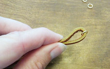 adding jump rings to a leather strip for bracelet