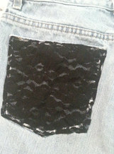 Black lace on jean pocket