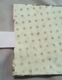 Gluing endpapers and ribbon on memory book