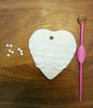 Adding lace and pearls to rustic Christmas ornament