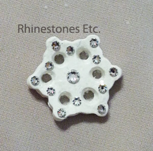 Gluing rhinestones to the snowflake pin