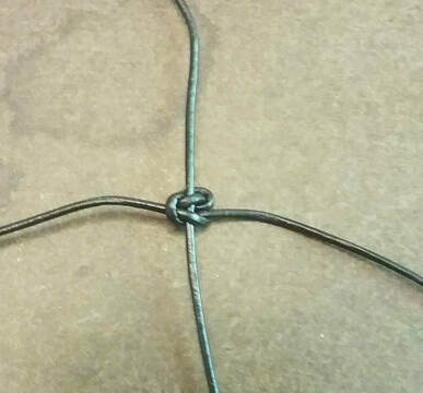 A square knot in macrame bracelet making