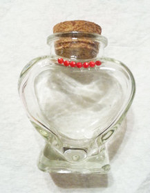Gluing rhinestones to a glass bottle