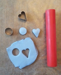 Rolling out clay and making clay charms