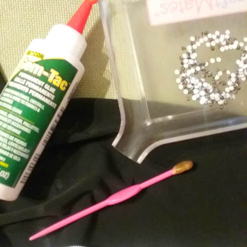 Some tools used for gluing on rhinestones