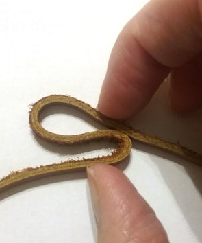 making a noose knot in leather cord