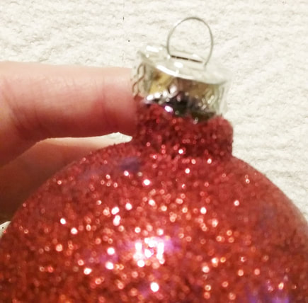 Remove top part of the ornament to glue lace to ornament
