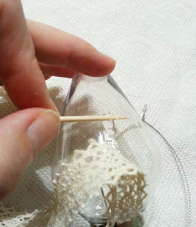 Gluing lace to tree ornament