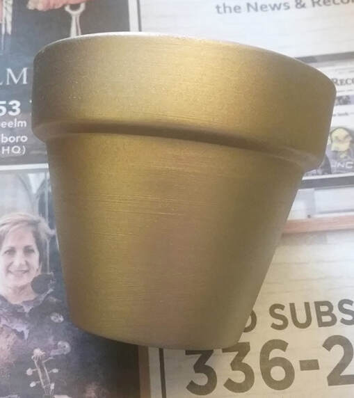 Gold painted terra cotta pot